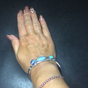 Community bangle bracelet. Blue beads. Silver tone. Stamped Community.